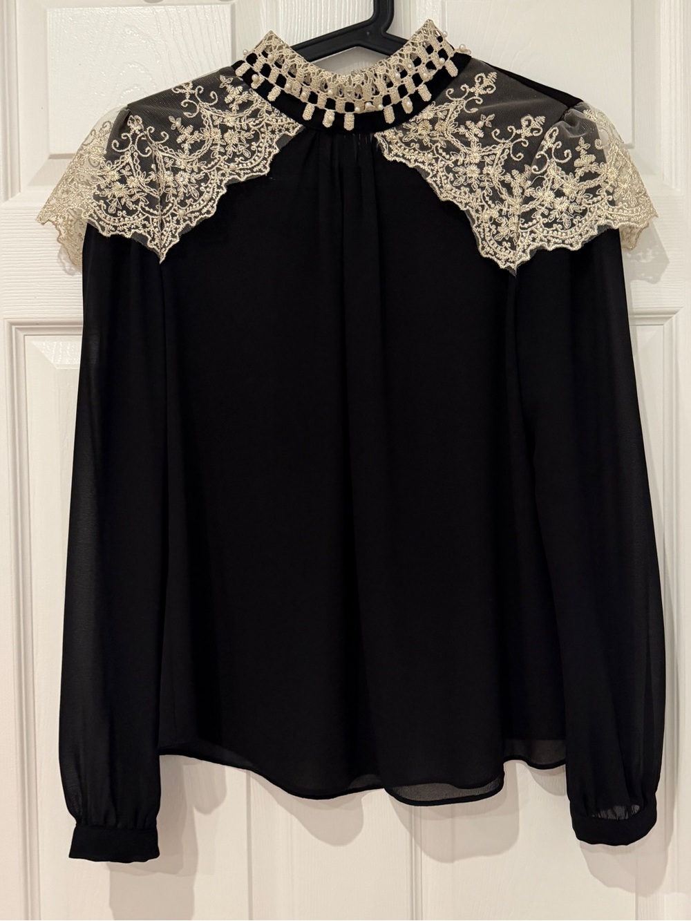Elegant Black Blouse with Cream Lace Collar